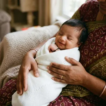 Doctor with newborn baby